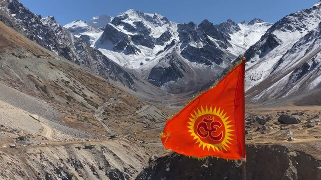 Om flag fluttering near Om Parvat is a sacred peak in the Himalayas whose snow deposition pattern resembles the sacred 'Om'. Situated in Uttarakhand, India