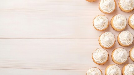 Obraz premium Delicious Creamy Vanilla Cupcakes on Wooden Table Background