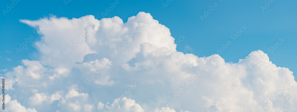 Wall mural blue sky with a few clouds. the sky is very bright and the clouds are scattered throughout. beautifu