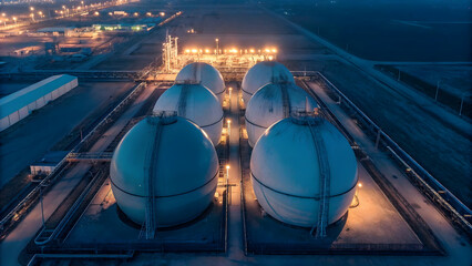 Large Industrial Storage Tanks at Sunset in Modern Energy Facility