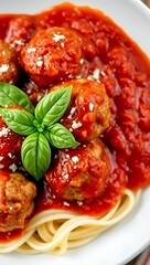 Closeup of meatballs and spaghetti with tomato sauce dish, a classic Italian meal