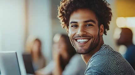 Smiling Man with Curly Hair, Positive and Joyful in a Collaborative Workspace, Encourages Teamwork and Success.