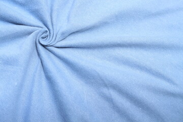 detailed crumpled blue t-shirt fabric. ideal for textile design or fabric texture visuals.