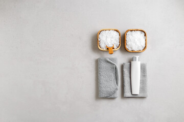 Spa or bath set of eco-friendly beauty products as minimal banner on light gray background. White Magnesium salt, cotton towels, natural brushes, wooden massagers, sustainable home self-care routines