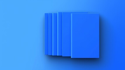 Blue books stacked on a simple background showcasing a clean and modern design