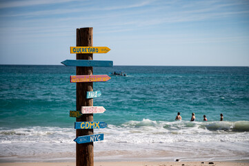 A variety of mostly tongue-in-check directional signs next to the beach at Cabo Pulmo, a protected National Marine Park recognized as a World Heritage Site by UNESCO.