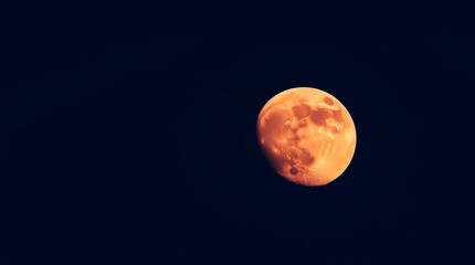 Fototapeta premium The moon is not yet full during twilight.