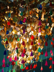 Gold leaves hanging on golden tree, decorating yellow pho leaf, symbol of buddhism religion