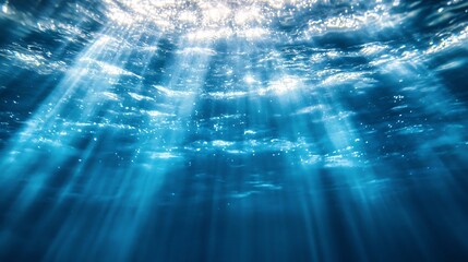 Obraz premium Sunlight beams underwater. Ocean depths, underwater light, marine life, nature, beauty, tranquility.