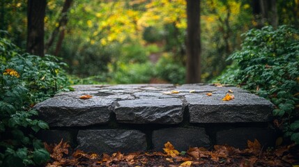 Weathered stone tabletop in a tropical garden, surrounded by vibrant blurred greenery