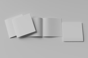 stack of three Open and closed blank brochures on grey background