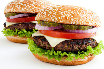Juicy burgers with fresh toppings on sesame buns