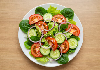 Vibrant Vegetable Salad with Tomato, Cucumber, Onion, Spinach, Lettuce, and Sesame – Healthy Diet Menu, Top View