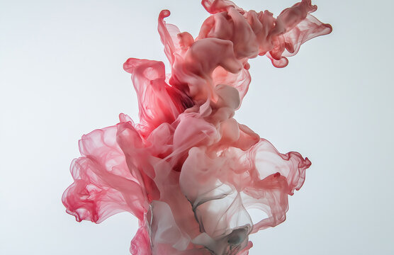 Vivid and colorful ink flowing gracefully in water, set against a crisp white background. Captured in high-resolution photography, showcasing insane detail and professional color grading for a stunnin