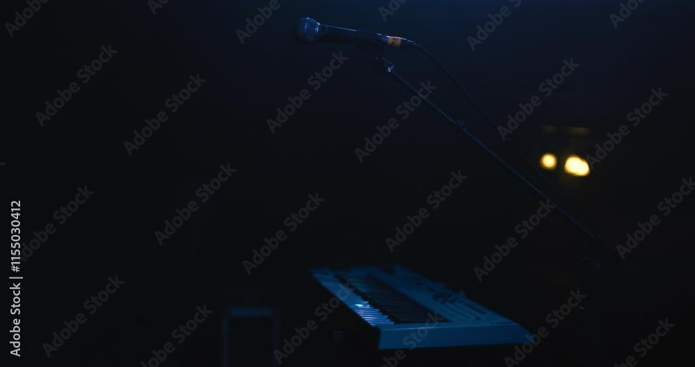 Poster amazing still shot of a synthesizer keyboard with a microphone on stage with low lighting before sta