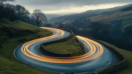 Light trails of cars on the winding road, landscape photography, hillside