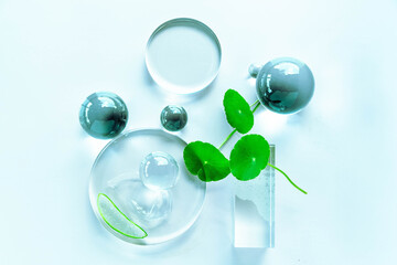 Aloe and centella products arranged artistically among crystal glassware to enhance spa aesthetics.