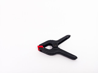 black plastic clamp isolated on white background, for industrial manufacturing plastic product catalog design