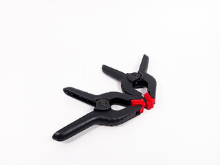 black plastic clamp isolated on white background, for industrial manufacturing plastic product catalog design