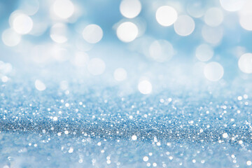 Obraz premium De-focused. Abstract elegant, detailed blue glitter particles flow with shallow depth of field underwater. Holiday magic shimmering luxury background. Festive sparkles