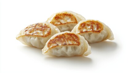 Four pan-fried dumplings isolated on white background.