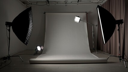 Professional studio for photo and video production filming with modern lighting equipment, large...