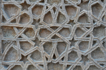 A historical building framed with artistically carved stonework. Architectural detail from the...