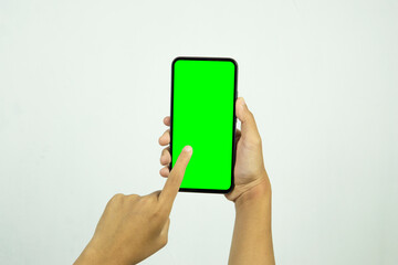 Hand holding smartphone with blank screen isolated on white background