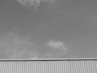 Black and white of industrial factory building with aluminum metal texture on the exterior wall,...