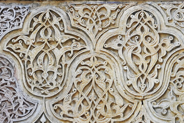 A historical building framed with artistically carved stonework. Architectural detail from the...