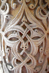 A historical building framed with artistically carved stonework. Architectural detail from the...