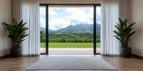 Fototapeta premium Mindful living and wellness spirituality concept. Modern interior yoga space with mountain view through large sliding doors and plants.