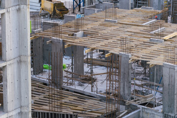Construction workers working on Construction machine. Aerial platform for workers who work at height on buildings. 