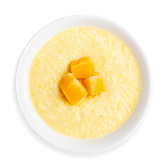 Corn porridge with mango pieces, on a white background, isolated. Top view. Breakfast