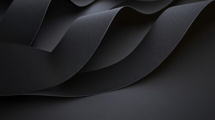 Fototapeta premium An abstract composition of flowing black fabric showcasing smooth curves and elegant shadows.
