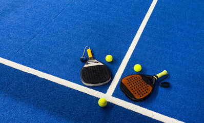 Padel tennis racket. Background with copy space. Sport court and balls.
