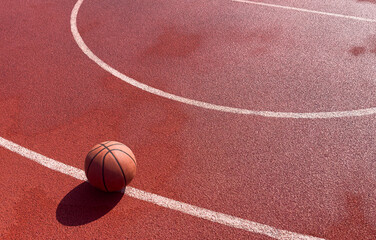 Basketball ball on the urban court background.
