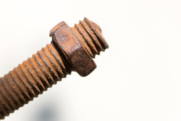 rusty nut. Rusty iron rod with screw threads. Rusted mechanical components. threaded bolt and nut isolated close up. dismantling concept, difficult to unscrew, non-removable. space for text