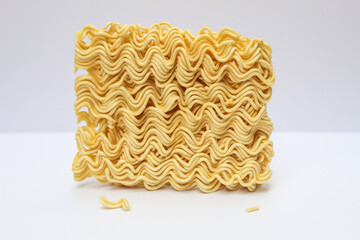 noodle shape with white background. instant noodles commonly eaten by asian people. image with white background isolated