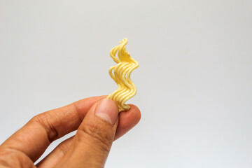 noodle shape with white background. instant noodles commonly eaten by asian people. image with white background isolated