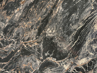 Black marble with gold brown veins.  Gold dragon black marble, golden veins and grains. Seamless marble background texture