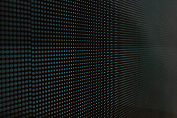 Close-up photo of video wall screen on black background with pixel grid layout for digital display...