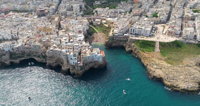 Lama Monachile And Modugno Seafront Cliff In Polignano a Mare, Puglia, Italy. - aerial shot