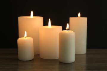 Burning candles in a dark space