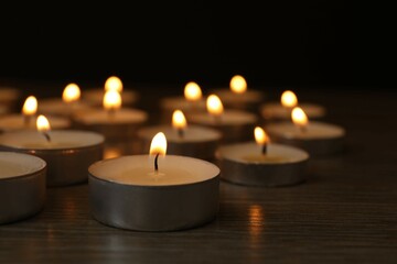 Burning candles in a dark space