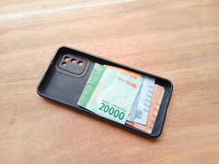banknotes in phone case. money stored safely in the phone case. multifunctional cellphone casing