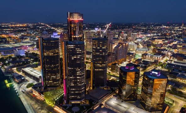 Detroit skyline at night, illuminated skyscrapers, aerial view. Modern city lights. GMRENCEN, DETROIT, MICHIGAN, UNITED STATES