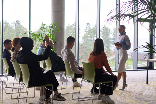 A businesswoman leader guiding a meeting with her colleagues, discussing business challenges, marketing strategies, and new plans for growth and success