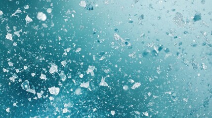 Obraz premium Abstract teal background with scattered ice shards.