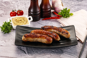 Delicous natural roasted sausages in the plate